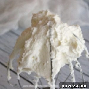 White Buttercream Frosting, perfectly white with a rich, buttery taste, ideal for any celebration cake.