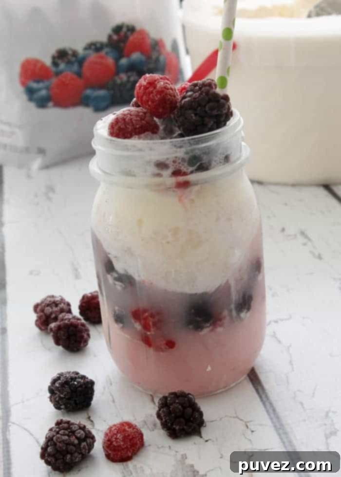 Delicious Fruity Ice Cream Float with vibrant berries and creamy ice cream, perfect for sharing on Pinterest.
