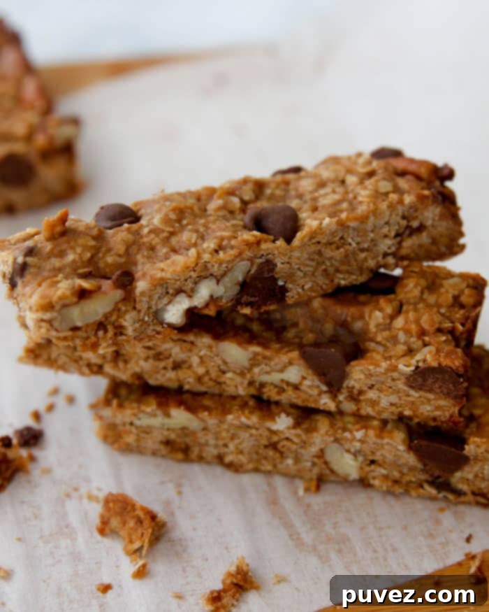 A stack of homemade Peanut Butter Chocolate Chip Granola Bars