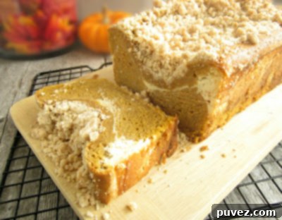 Slice of Pumpkin Streusel Bread with Cream Cheese Swirl
