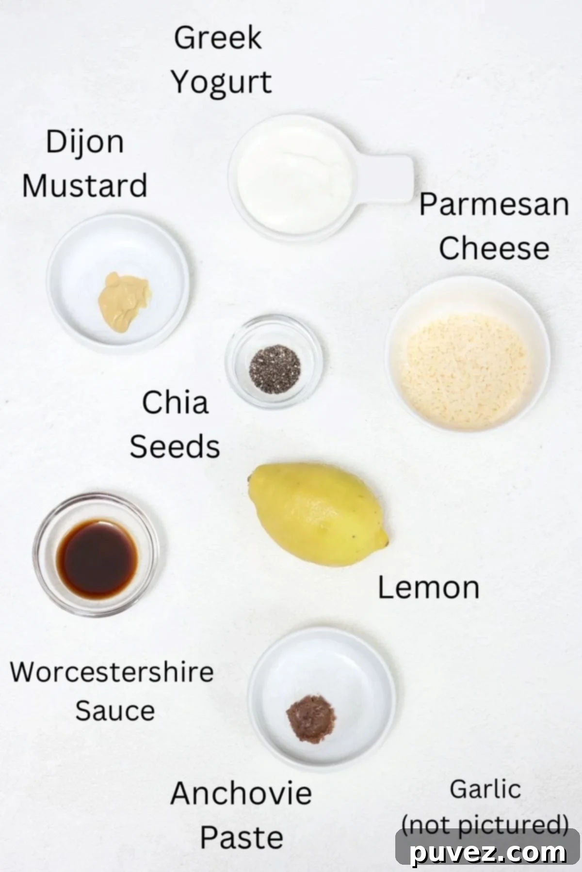 Ingredients for making homemade Caesar dressing, labeled.