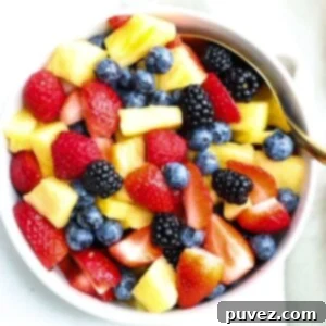 Top view of a bowl of fresh fruit salad.