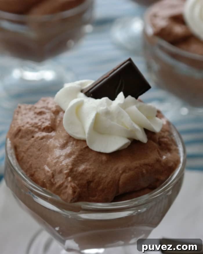 Easy Whipped Dark Chocolate Mousse-just 3 ingredients to create this delicate dessert, the secret is using good dark chocolate! Green & Black 70% Dark Chocolate makes this dessert decadent! 