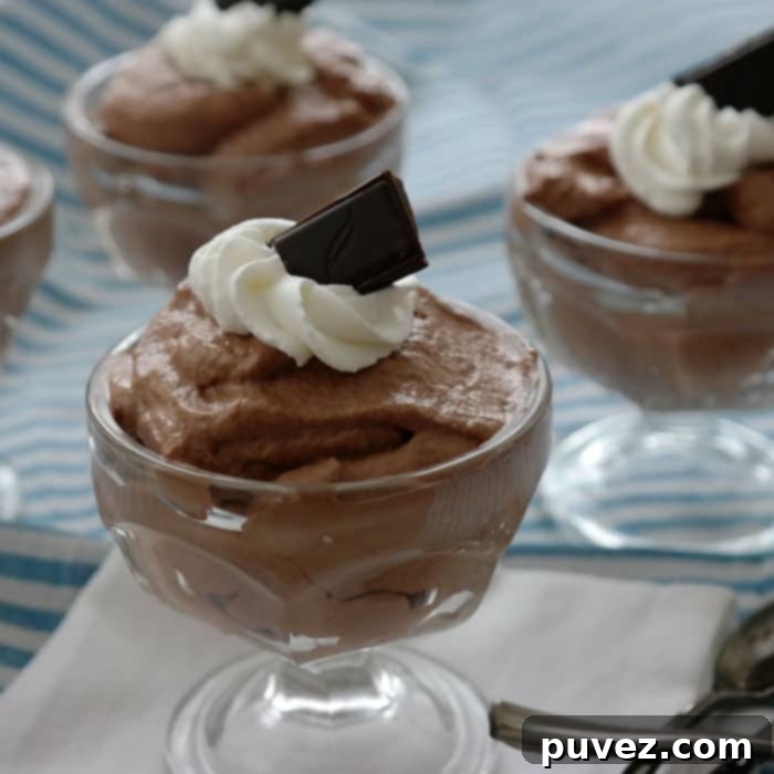Easy Whipped Dark Chocolate Mousse-just 3 ingredients to create this delicate dessert, the secret is using good dark chocolate! Green & Black 70% Dark Chocolate makes this dessert decadent! 