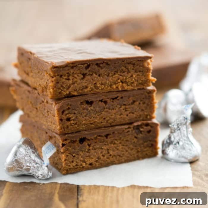 Close-up shot of Hershey's Kisses brownies with a bite taken out, revealing the gooey interior