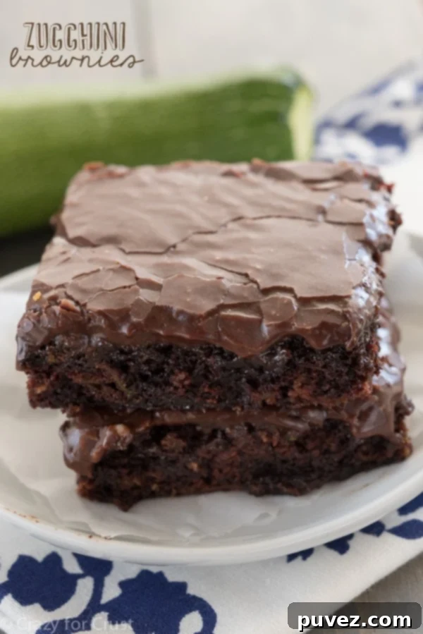 Moist Zucchini Brownies topped with a smooth chocolate frosting