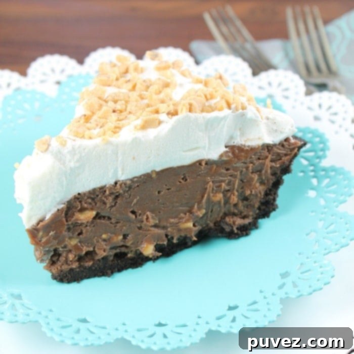 Slice of No-Bake Milk Chocolate & Toffee Fudge Pie with whipped topping