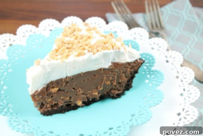 Close-up of a slice of Milk Chocolate and Toffee Fudge Pie with a fork