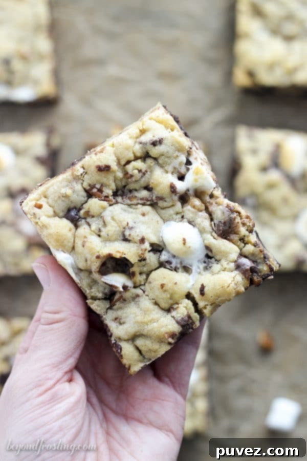 Experience the ultimate Ooey Gooey Mississippi Mud Brookies! These decadent layered bars are bursting with rich chocolate chips, crunchy pecans, and soft mini marshmallows. Indulge in every bite and decide for yourself if the fudgy chocolate brownie layer or the chewy chocolate chip cookie layer is your favorite!