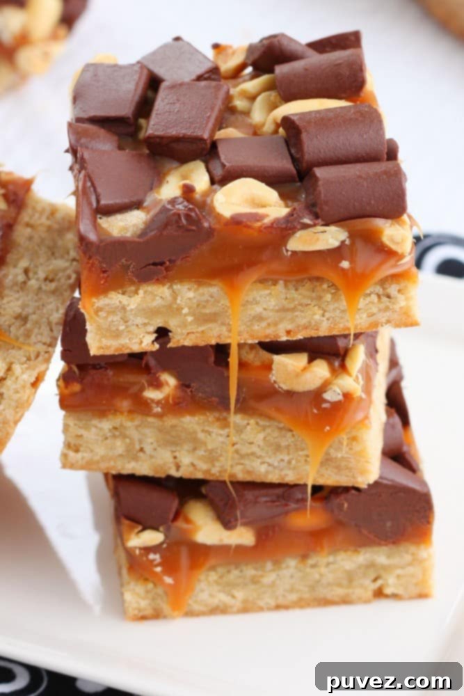 Close-up of a cut Salty Caramel Chocolate Bar, showing the distinct layers and delicious texture.