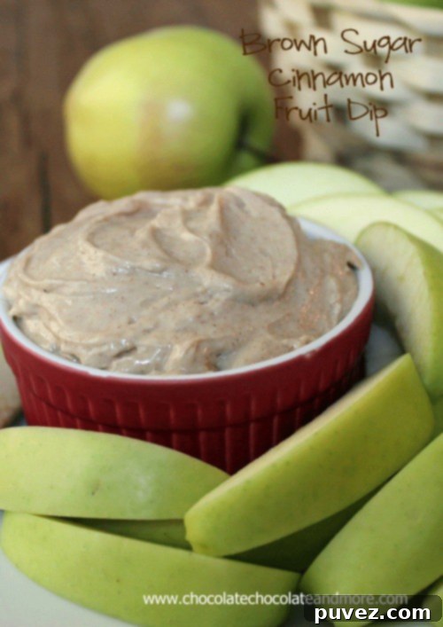 A vibrant image of the Brown Sugar Cinnamon Fruit Dip with a variety of fresh fruits and crackers for dipping.