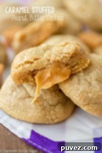 Caramel Stuffed Peanut Butter Cookies - Deliciously soft peanut butter cookies with a gooey caramel center.