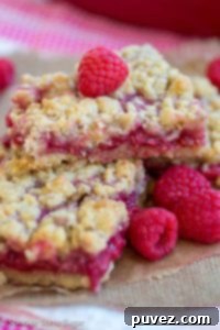 Raspberry Lemon Crumble Bars - A super easy recipe for sweet and tart raspberry lemon crumble bars!