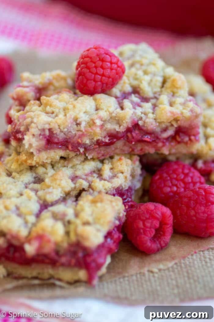 Raspberry Lemon Crumble Bars - A super easy recipe for sweet and tart raspberry lemon crumble bars!