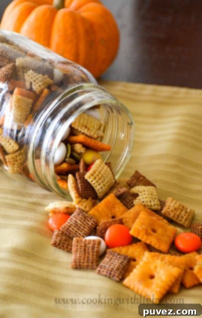 Fall Harvest Chex Mix in a festive jar.