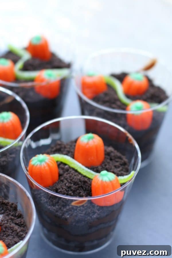 Pumpkin Patch Dirt Cups with gummy worms.