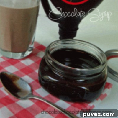 Delicious homemade chocolate syrup in a glass jar, ready to enjoy.