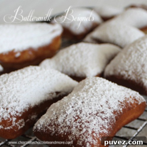 Fluffy, golden-brown Buttermilk Beignets or French Donuts dusted with powdered sugar