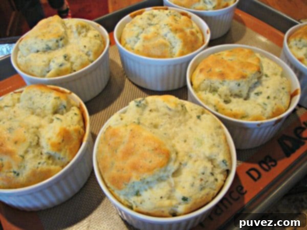 Light and airy Herbed Cheese Souffles baked in individual ramekins