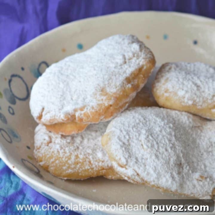 15 Festive Carnival Recipes 2 Elephant Ears, a large flat fried dough dusted with powdered sugar