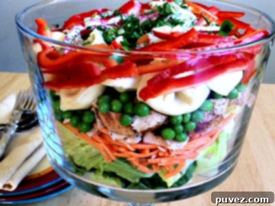 Beautifully layered tortellini salad with pesto dressing