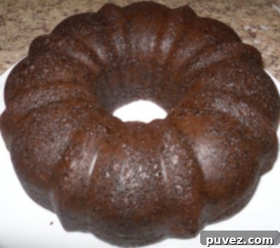 Decadent Triple Chocolate Bundt Cake, elegantly glazed and ready to serve, a featured recipe from Recipes for my Boys blog