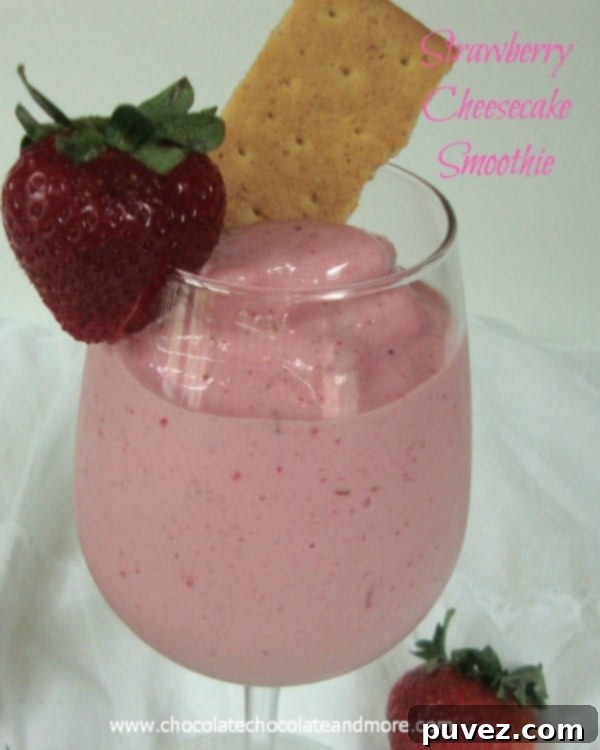 Delicious Strawberry Cheesecake Smoothie in a tall glass.