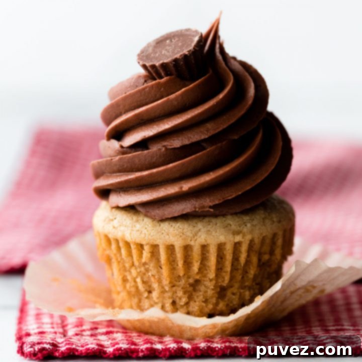Delicious Peanut Butter Cupcakes with creamy frosting and a miniature peanut butter cup on top.