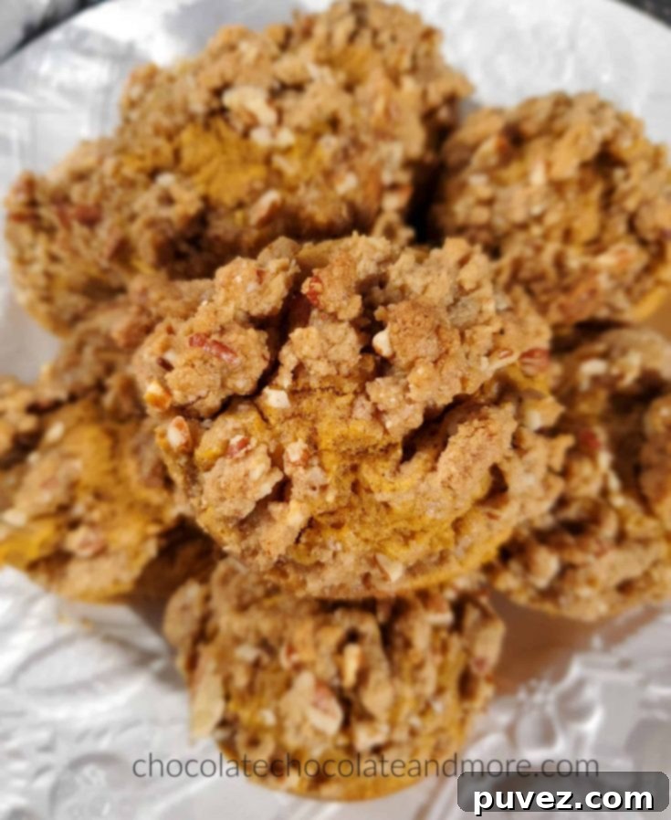 Decadent Sweet Potato Praline Muffins 5 a plate full of sweet potato praline muffins stacked up