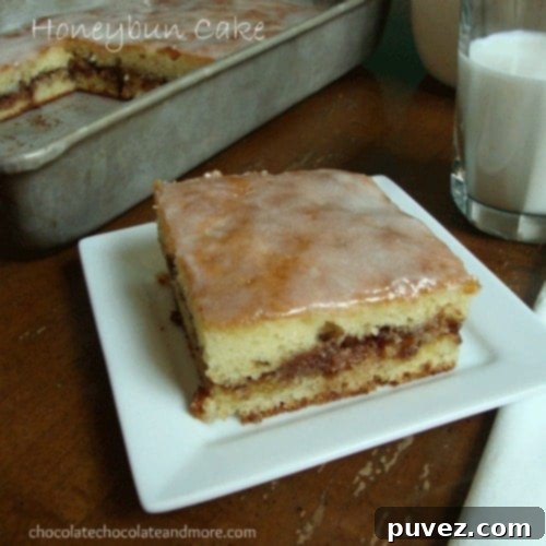 A slice of moist Honey Bun Cake with glaze