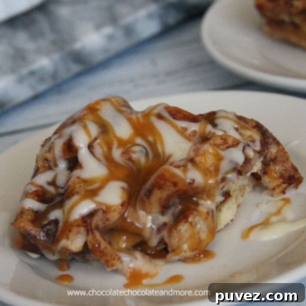 A warm dish of Cinnabon Bread Pudding, topped with a sweet glaze, promising comfort and flavor.