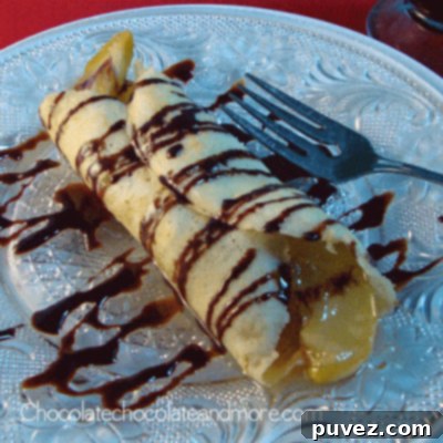 Gourmet crepes with caramelized apples and chocolate drizzle