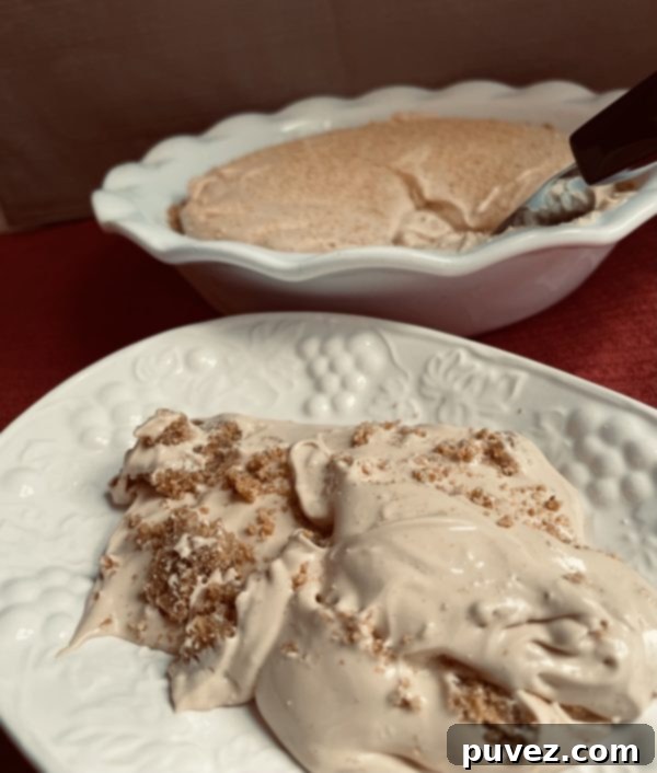 Caramel Pie Pudding scooped onto a decorative plate