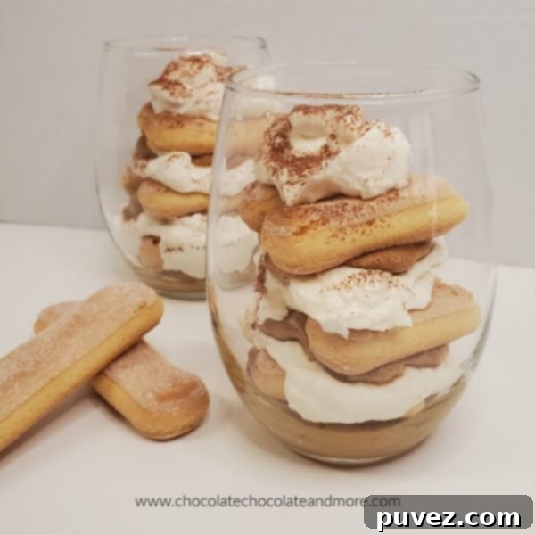 clear glasses filled with layers of cream filling and lady finger cookies