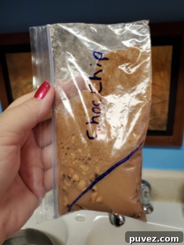 Quick And Easy 1 Minute Mug Cake 4 A chocolate mug cake being carefully removed from a mug using a coffee filter lining, showing a clean release.