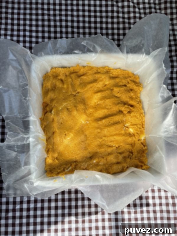 The cake mixture spread into the baking dish.