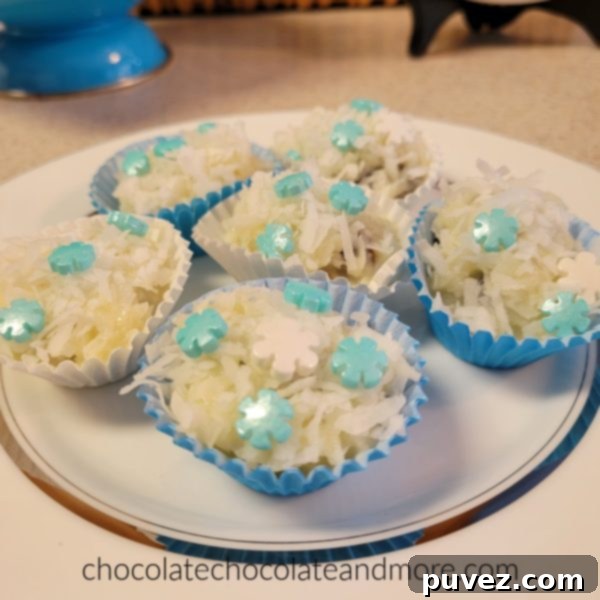 A close-up showing the messy but fun process of mixing the coconut and condensed milk, with small hands clearly involved.