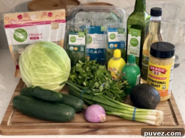 All the fresh and vibrant ingredients meticulously arranged on a rustic wooden cutting board, ready to be transformed into the delicious and healthy Green Goddess Salad dressing.