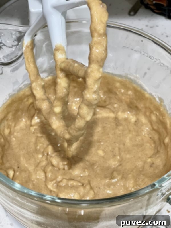 Dry ingredients perfectly incorporated into the wet ingredients and bananas, forming a cohesive batter