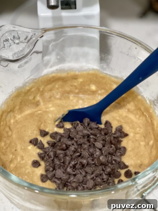 Abundant chocolate chips beautifully folded into the rich banana bread cake batter