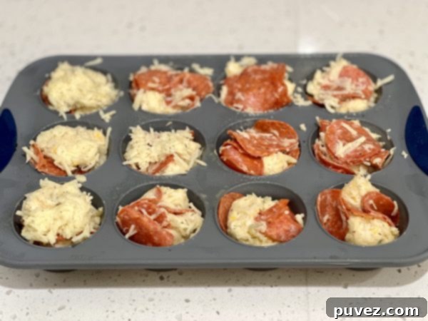 Pepperoni Bread Cups mixture in the cupcake pan, ready for baking