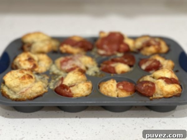 Baked Pepperoni Bread Cups in the cupcake pan, golden brown and cheesy