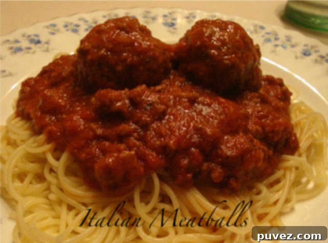 A beautifully arranged platter of homemade Italian meatballs, perfectly cooked and ready for serving with pasta or in sandwiches.
