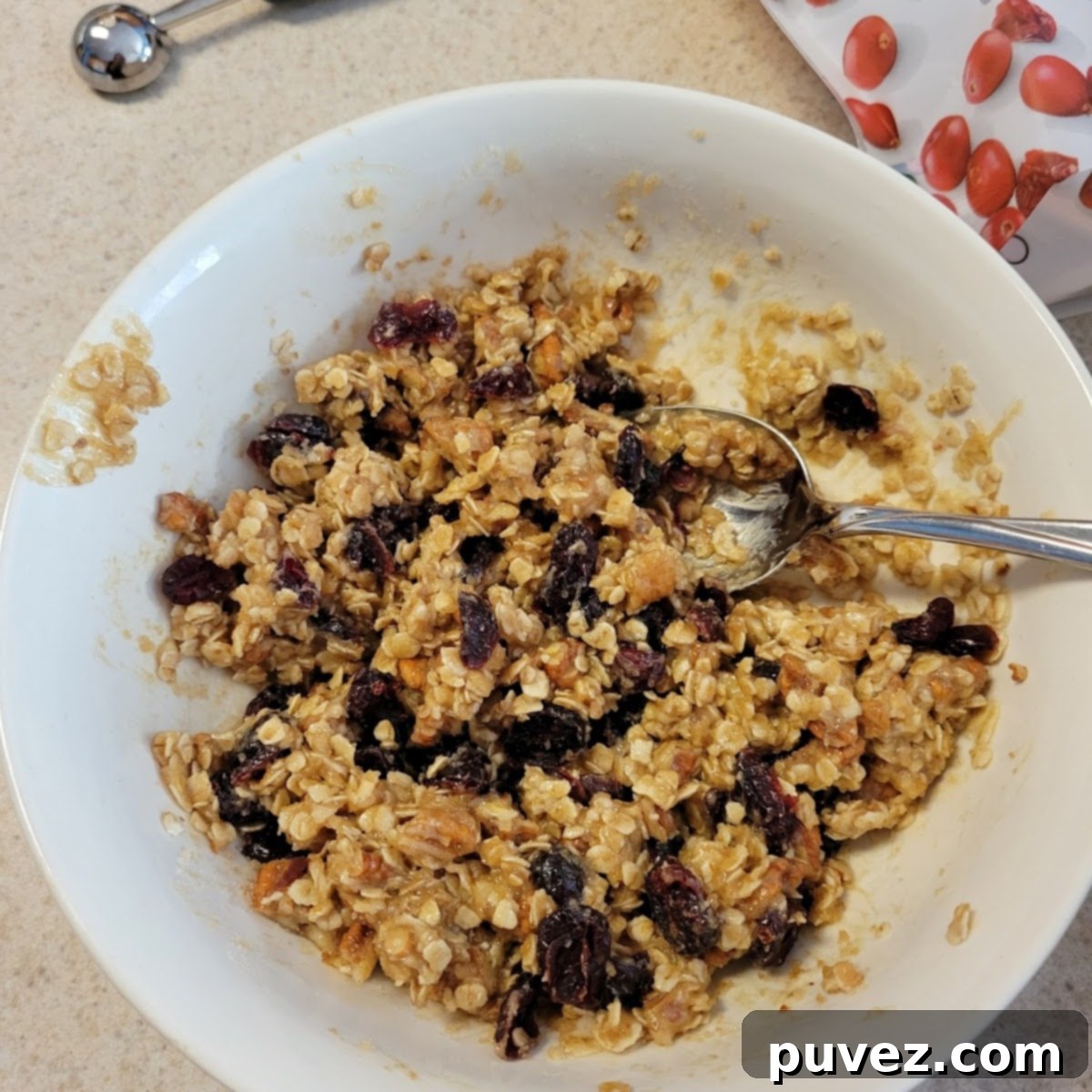 top down view of two baked apples with granola on a plate