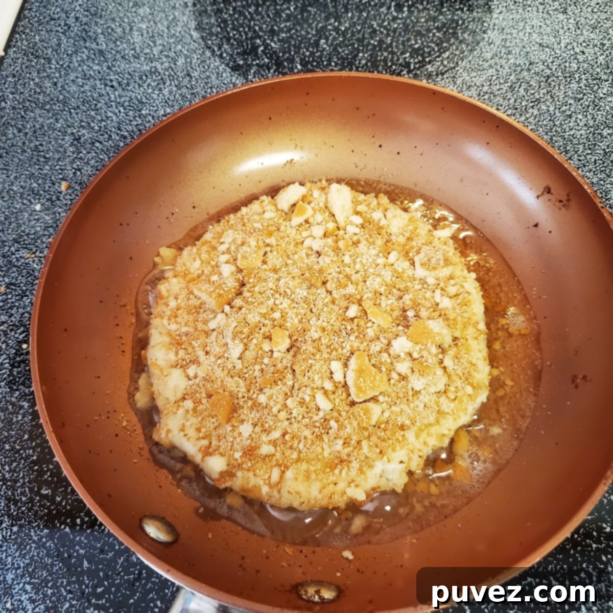 Ingredients for banana pudding pancakes: pancake mix, prepared banana pudding, and crushed vanilla wafers