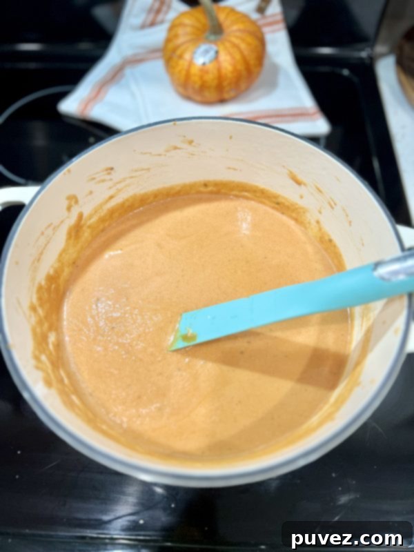 Creamy Pumpkin Soup in a pot on the stove
