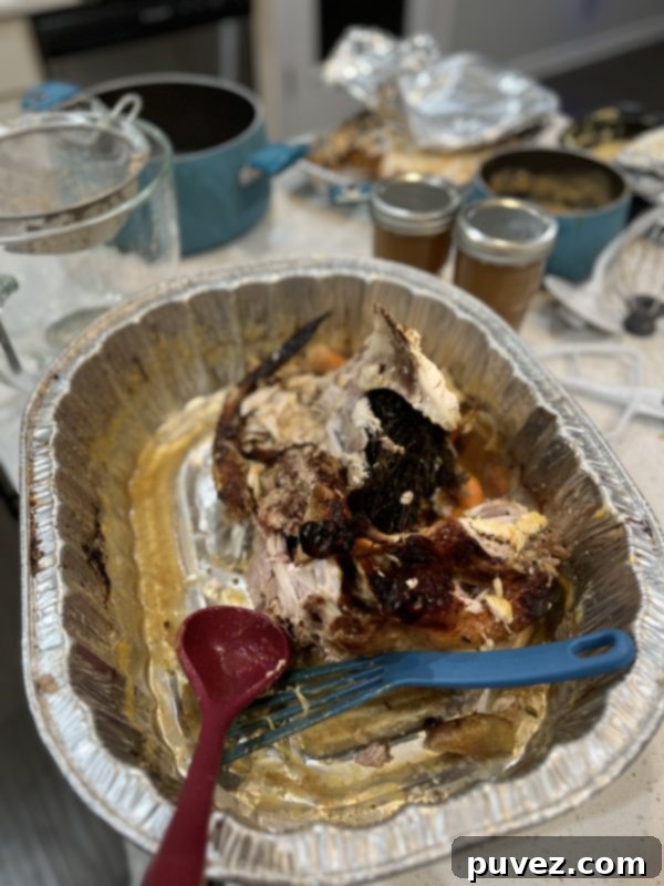 Leftover turkey carcass in an aluminum pan