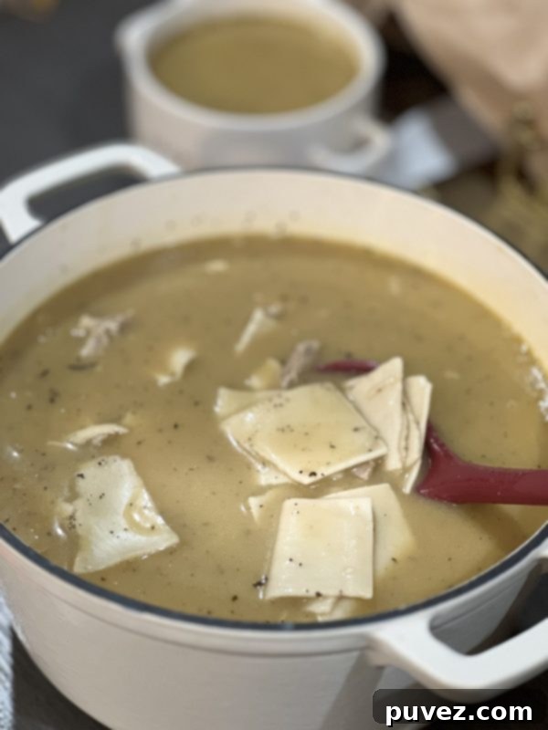 Leftover Turkey Dumplings in a white dutch oven