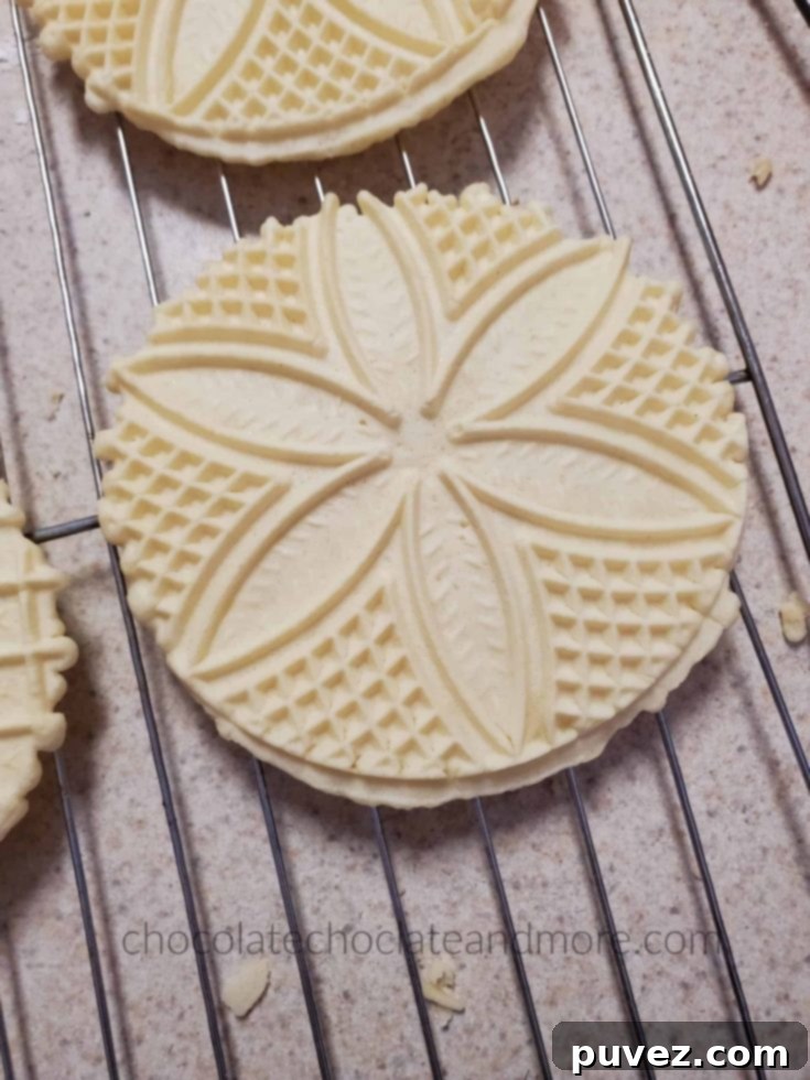 Delicate Italian Anise Pizzelles, wafer-thin cookies with a beautiful pattern.