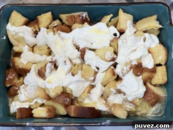 Strawberries and Cream French Toast Casserole in a baking dish, assembled and ready for the oven
